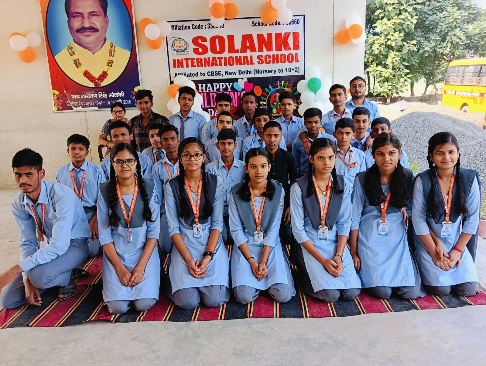 Students with school banner